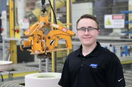 A picture of an employee holding reputable engineering and manufacturing jobs at Saint-Gobain.
