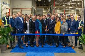 A group of Saint-Gobain and Hydro-Quebec employees celebrate the expansion of the Montreal plant.