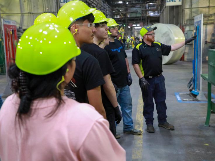 Students gain firsthand knowledge on the roofing plant floor during SFRC, a workforce development program.